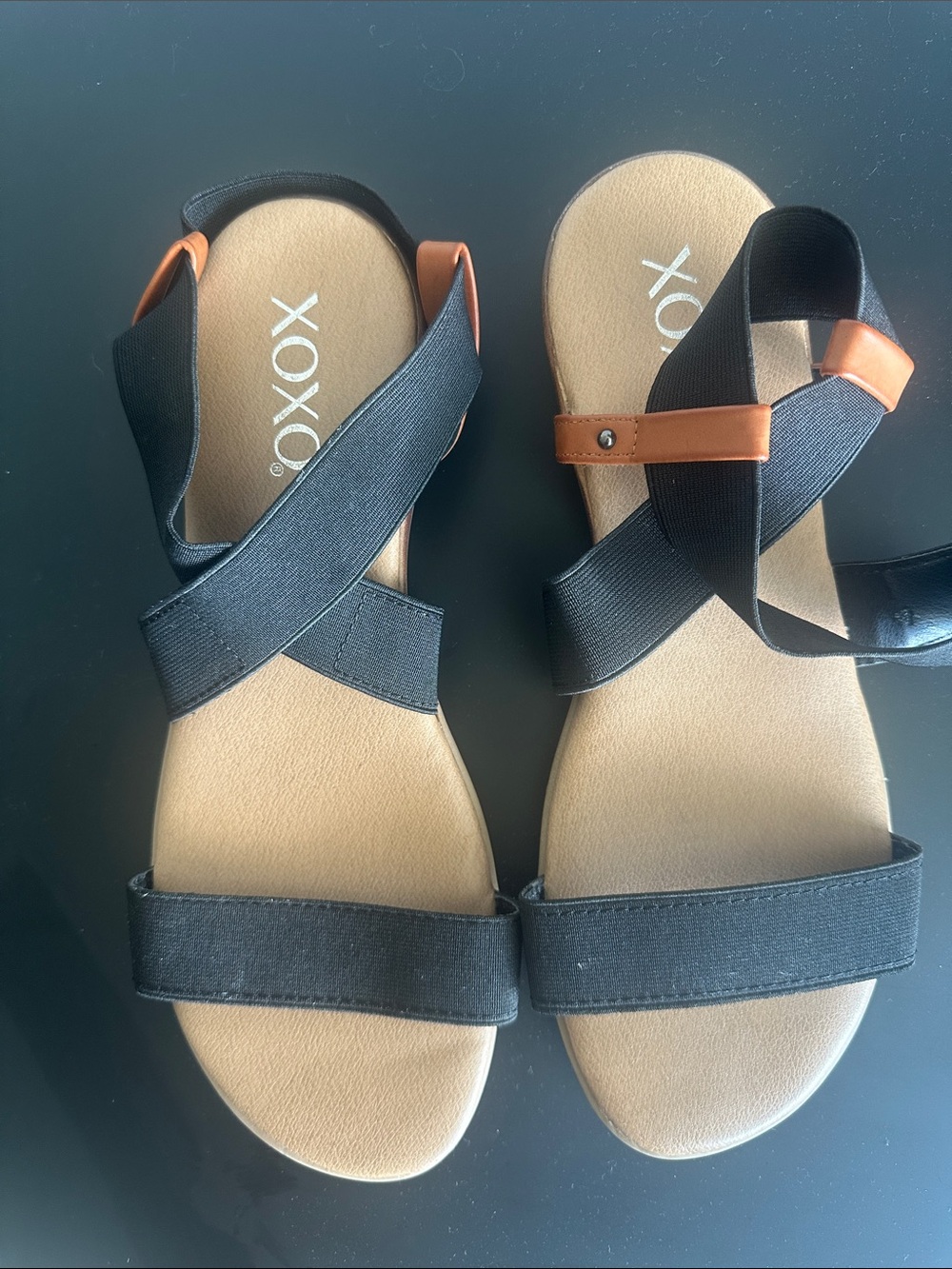 XOXO Black and Tan Cross-Strap Elastic Sandals